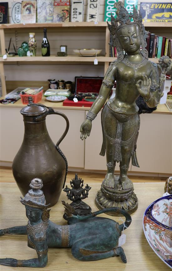 A large bronze figure of Bodhisattva, a Thai bronze figure and a Middle Eastern copper jug and another bronze figure (4) tallest 82cm